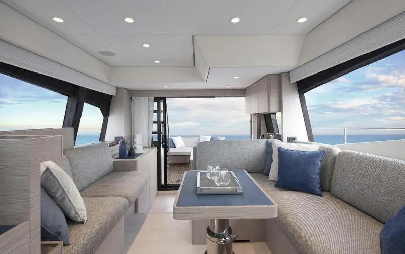 Yacht Photos Pics Luxurious interior of 2025 Ferretti Yachts 500 with elegant seating and ocean view.