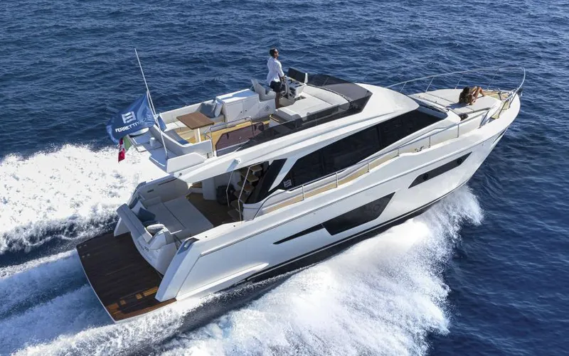  Yacht Photos Pics 2025 Ferretti Yachts 500 cruising on open sea, showcasing sleek design and luxury features.