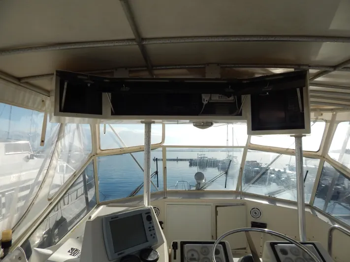  Yacht Photos Pics Interior view of 1981 Hatteras 50 Convertible yacht cockpit with navigation equipment.