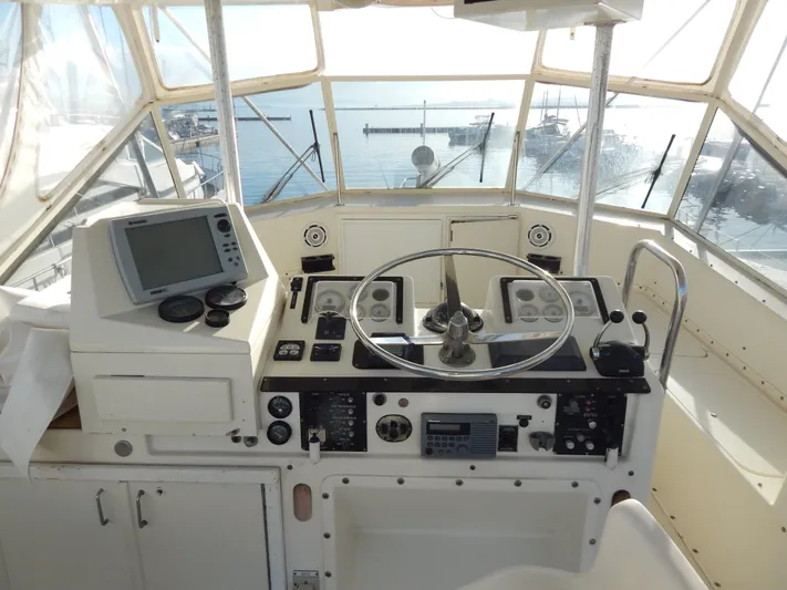  Yacht Photos Pics 1981 Hatteras 50 Convertible yacht helm with navigation equipment and ocean view.