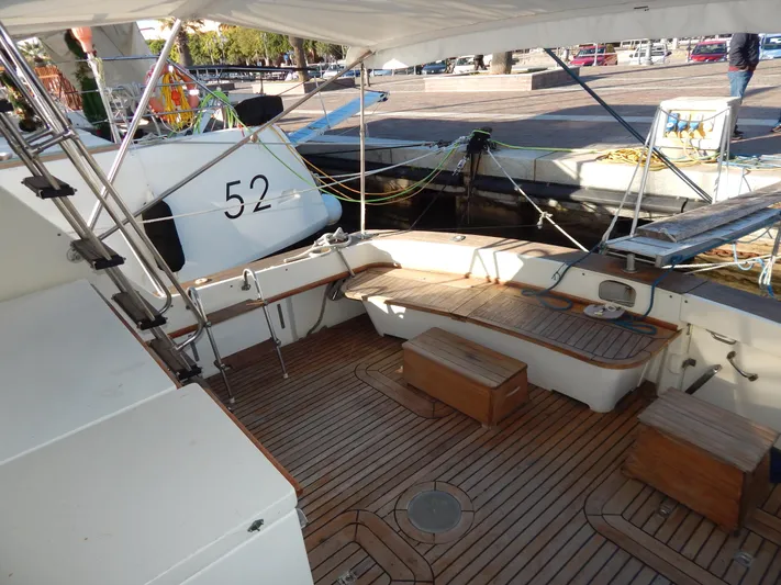  Yacht Photos Pics 1981 Hatteras 50 Convertible yacht with teak deck and seating, docked at marina.
