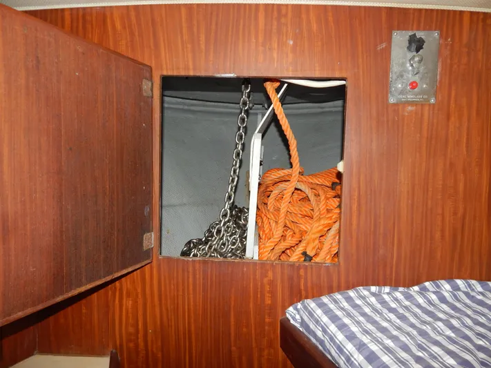  Yacht Photos Pics Anchor chain and rope storage in 1981 Hatteras 50 Convertible yacht interior.