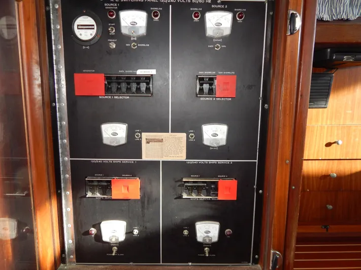  Yacht Photos Pics Electrical panel of a 1981 Hatteras 50 Convertible yacht, featuring switches and gauges.