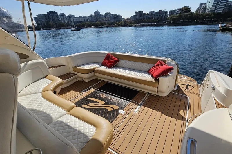  Yacht Photos Pics Luxurious 1999 Sea Ray 460 Sundancer yacht with elegant seating and scenic waterfront view.