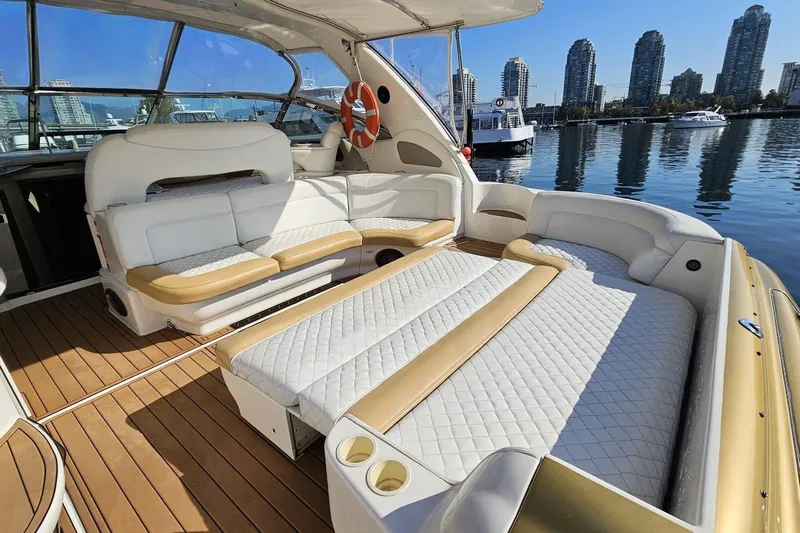  Yacht Photos Pics Luxurious 1999 Sea Ray 460 Sundancer yacht interior with plush seating and scenic waterfront view.