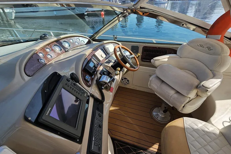  Yacht Photos Pics 1999 Sea Ray 460 Sundancer helm with luxurious seating and advanced navigation controls.