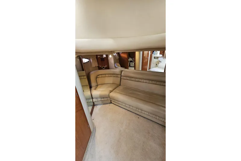  Yacht Photos Pics Interior of 1999 Sea Ray 460 Sundancer yacht with beige seating and carpet.
