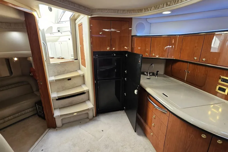  Yacht Photos Pics Luxurious interior of 1999 Sea Ray 460 Sundancer yacht with kitchen and stairs.
