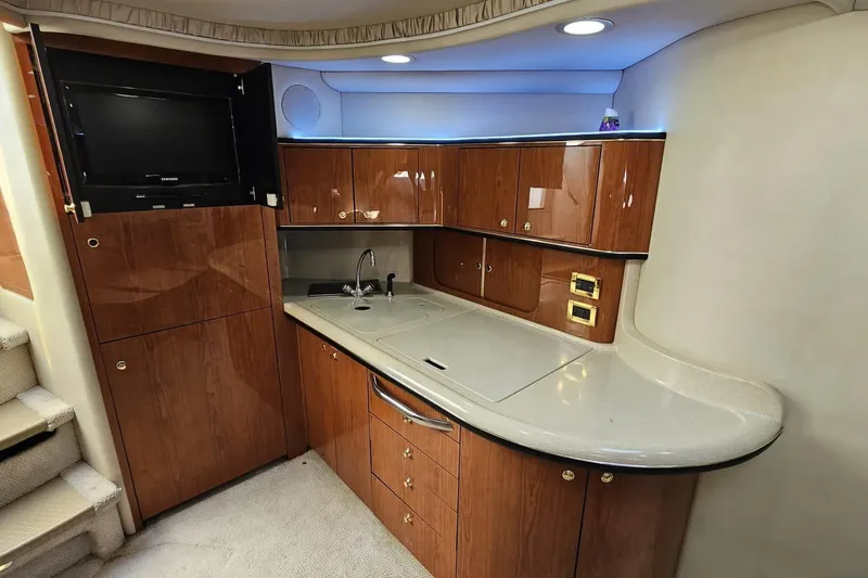 Yacht Photos Pics Luxurious 1999 Sea Ray 460 Sundancer yacht interior with sleek wooden cabinetry and modern amenities.