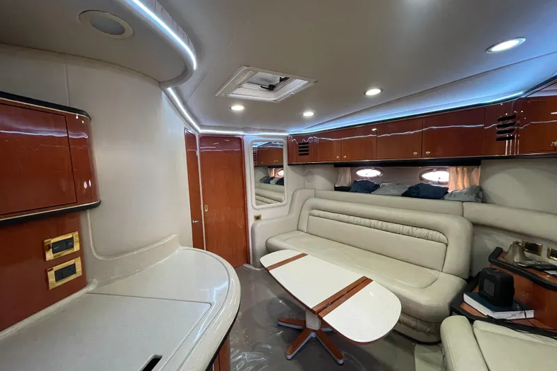 Yacht Photos Pics Luxurious interior of 1999 Sea Ray 460 Sundancer yacht with elegant seating and cabinetry.