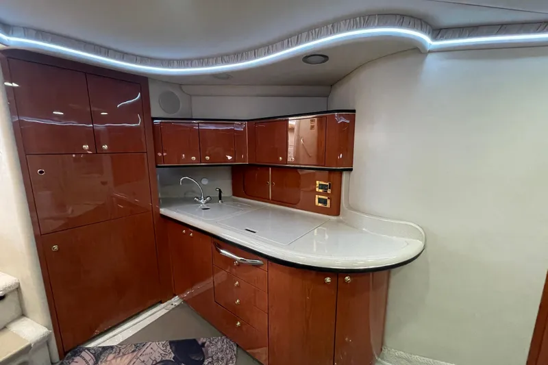  Yacht Photos Pics Luxurious 1999 Sea Ray 460 Sundancer yacht interior with sleek wooden cabinetry.