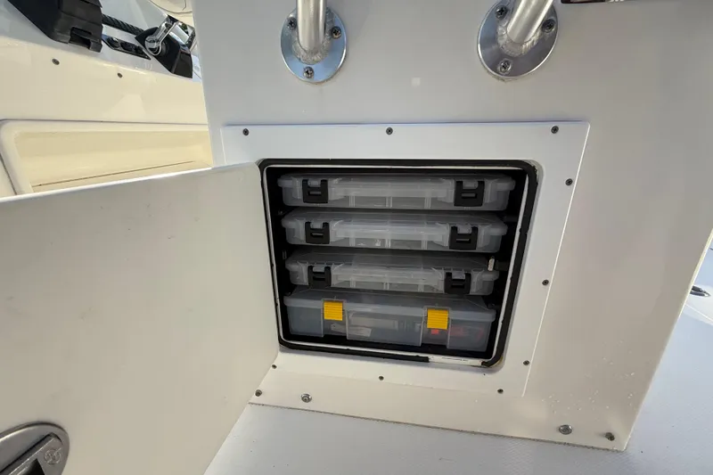  Yacht Photos Pics Storage compartment with tackle boxes on a 2009 Regulator 34SS boat.