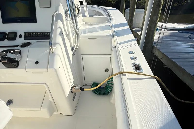  Yacht Photos Pics 2009 Regulator 34SS boat interior with control panel and docked hose.