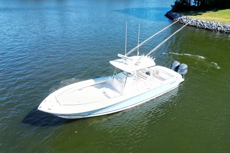  Yacht Photos Pics 2009 Regulator 34SS boat cruising on a calm lake.
