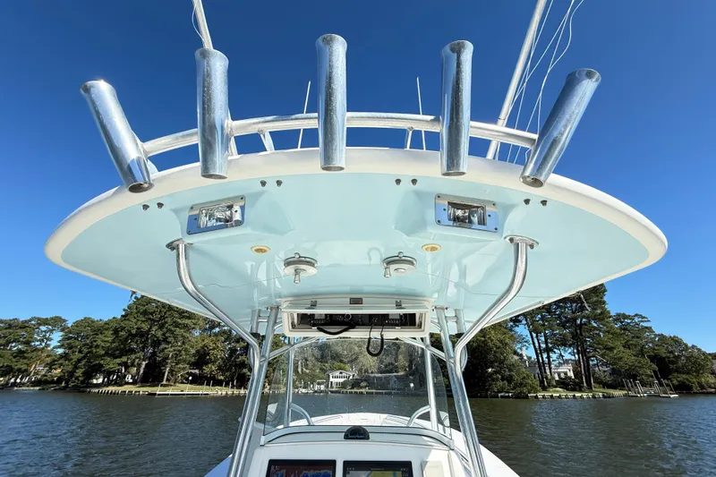 Yacht Photos Pics 2009 Regulator 34SS boat with rod holders and electronics, set against a clear blue sky.