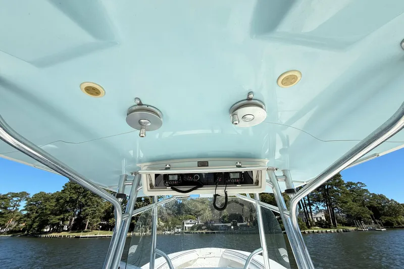  Yacht Photos Pics 2009 Regulator 34SS boat console with electronics, viewed from below, on a sunny day.