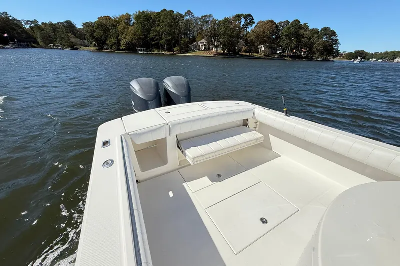  Yacht Photos Pics 2009 Regulator 34SS boat with dual engines on a calm lake.