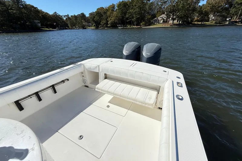  Yacht Photos Pics 2009 Regulator 34SS boat with dual engines on a calm lake.