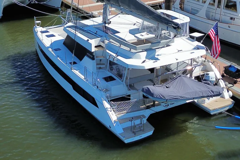 Jolly Time Yacht Photos Pics 2021 Leopard 42 catamaran docked, featuring sleek design and spacious deck.