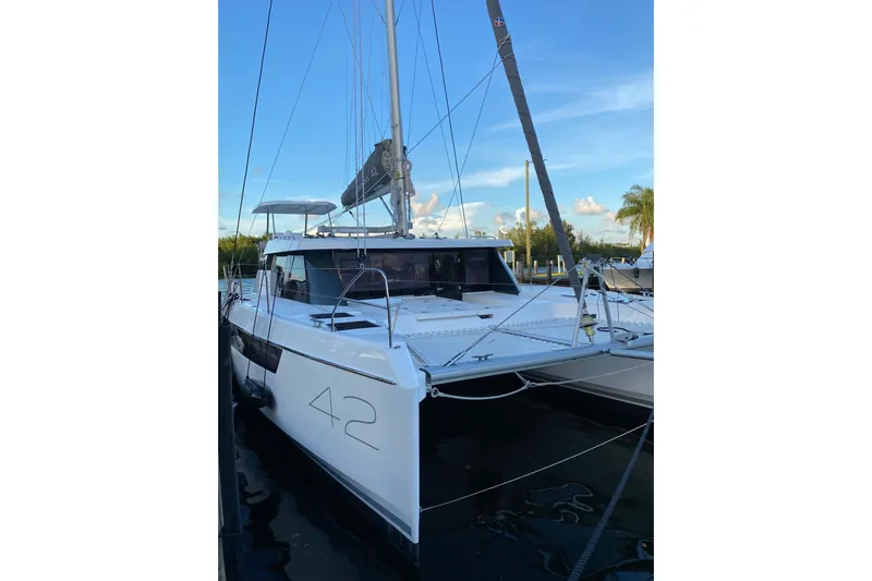 Jolly Time Yacht Photos Pics 2021 Leopard 42 catamaran docked, showcasing sleek design and modern features.