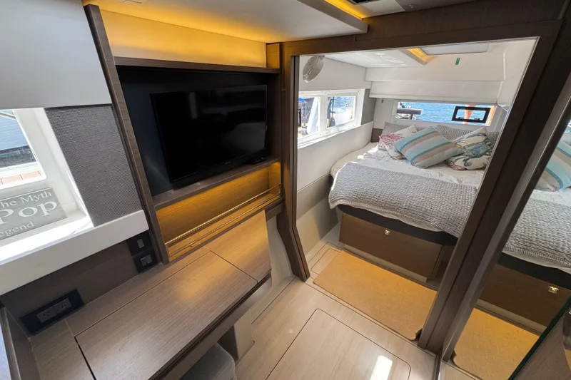 Jolly Time Yacht Photos Pics Luxurious interior of a 2021 Leopard 42 yacht featuring a cozy bedroom and modern amenities.