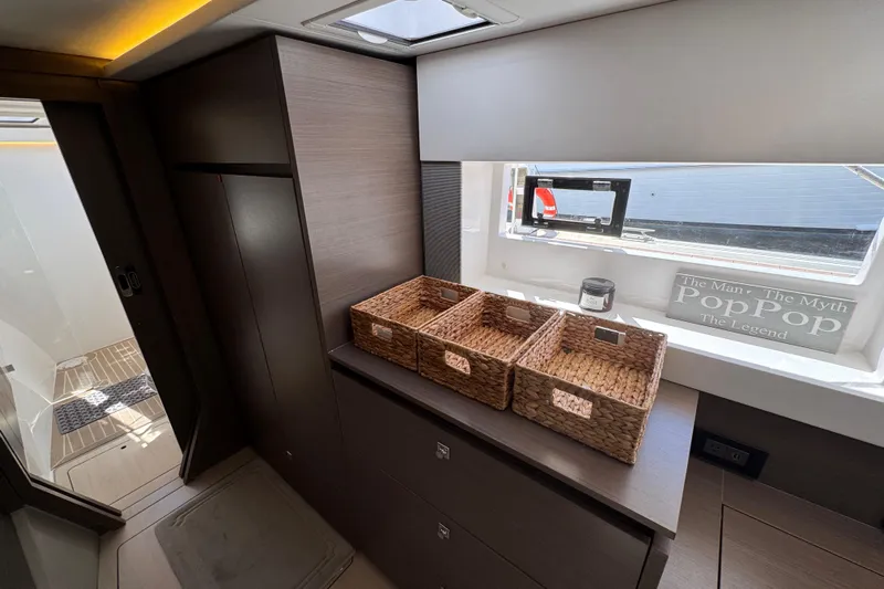 Jolly Time Yacht Photos Pics Modern Leopard 42 yacht interior with wicker baskets and decorative sign.