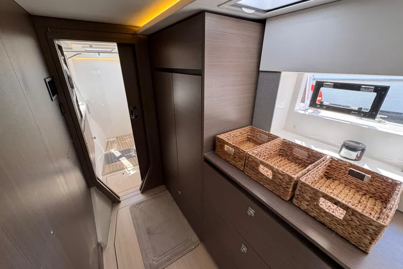 Jolly Time Yacht Photos Pics Modern interior of 2021 Leopard 42 yacht with wicker baskets and sleek design.