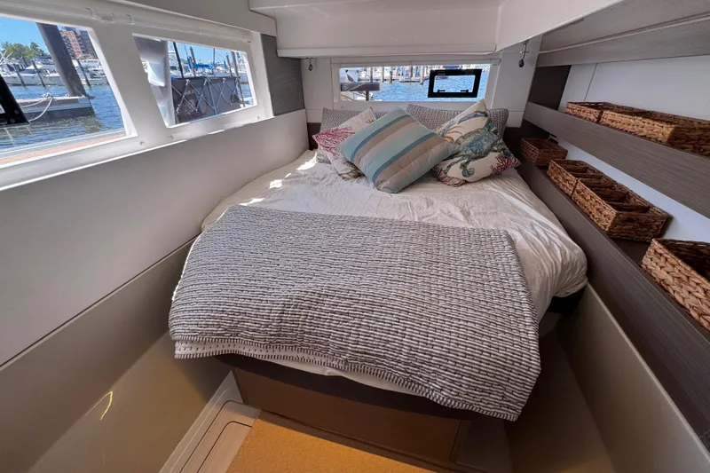 Jolly Time Yacht Photos Pics Cozy bedroom in 2021 Leopard 42 yacht with waterfront view and stylish decor.