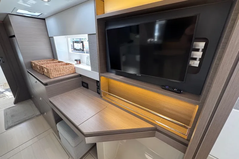 Jolly Time Yacht Photos Pics Modern interior of 2021 Leopard 42 yacht with TV and storage.