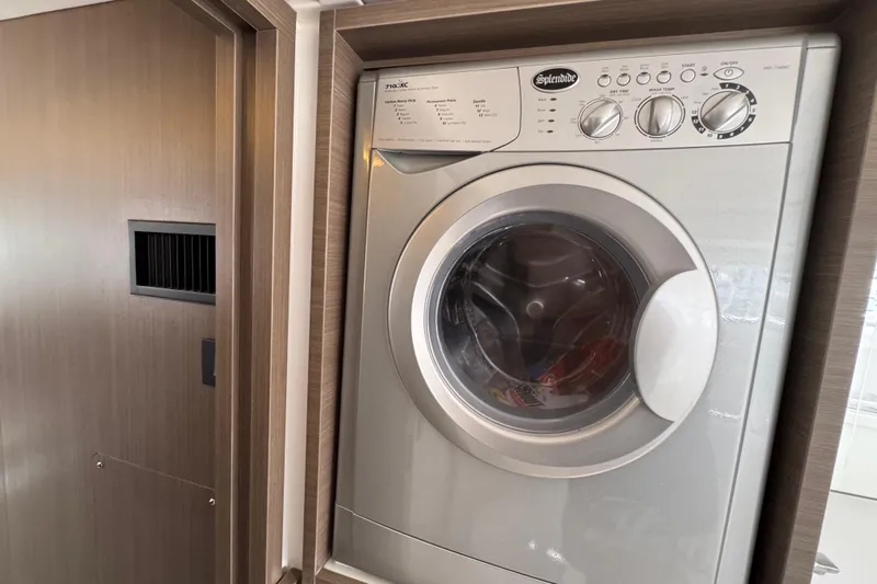 Jolly Time Yacht Photos Pics Front-loading washing machine in a 2021 Leopard 42 yacht interior.