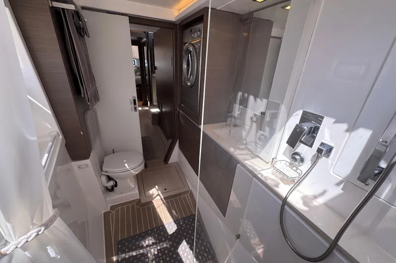Jolly Time Yacht Photos Pics Modern bathroom interior of 2021 Leopard 42 yacht with shower and toilet.