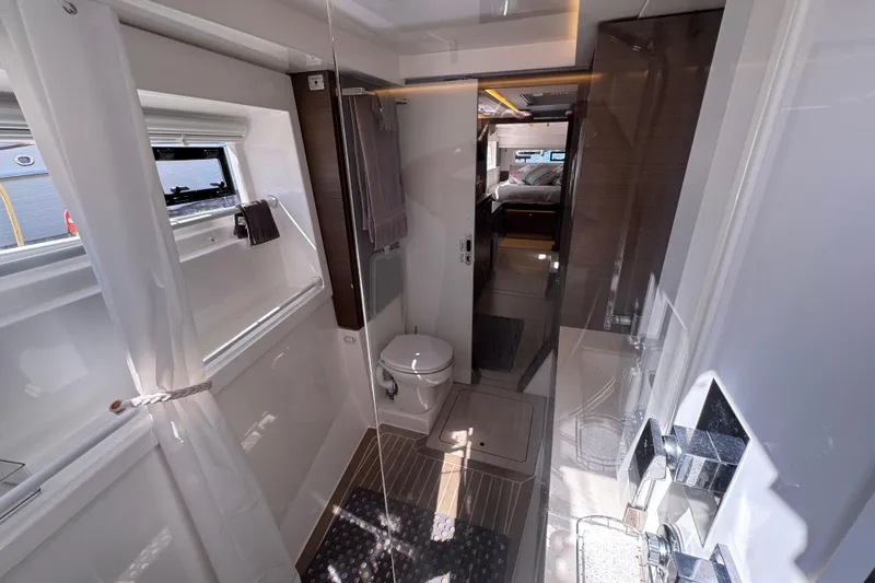 Jolly Time Yacht Photos Pics Modern bathroom interior of 2021 Leopard 42 yacht, featuring sleek design and natural lighting.