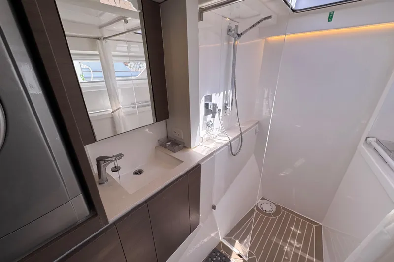 Jolly Time Yacht Photos Pics Modern bathroom in 2021 Leopard 42 yacht with sleek fixtures and shower.
