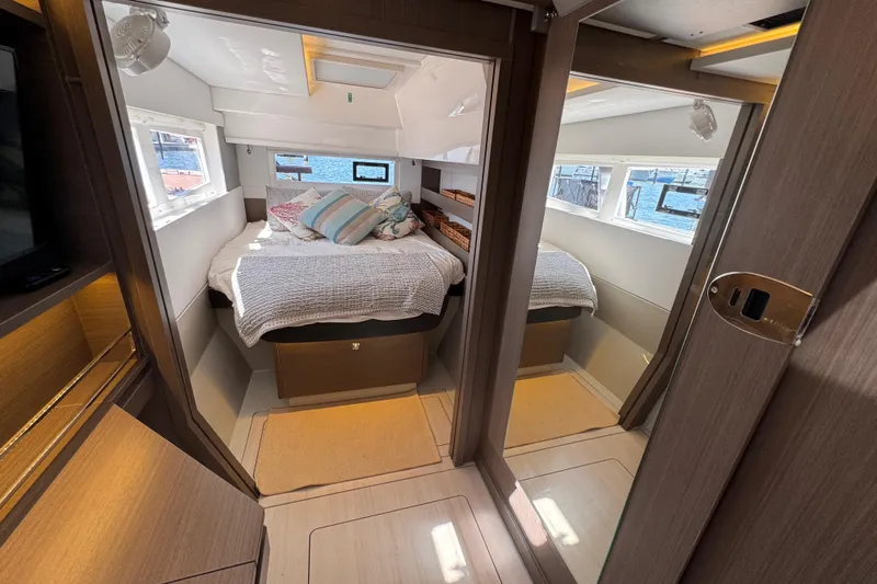 Jolly Time Yacht Photos Pics Luxurious cabin interior of 2021 Leopard 42 yacht with cozy bed and modern design.