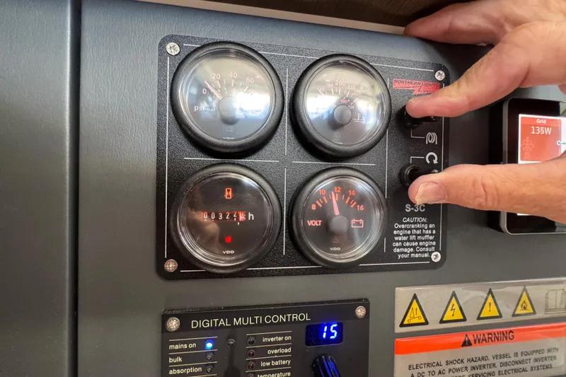 Jolly Time Yacht Photos Pics Control panel of a 2021 Leopard 42 with gauges and digital multi-control.