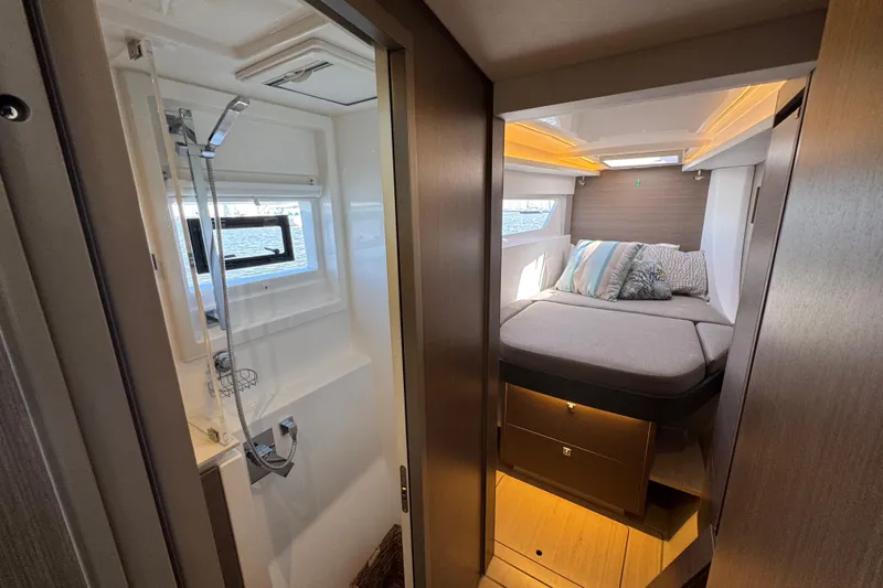 Jolly Time Yacht Photos Pics Luxurious interior of 2021 Leopard 42 yacht featuring cozy bedroom and modern bathroom.
