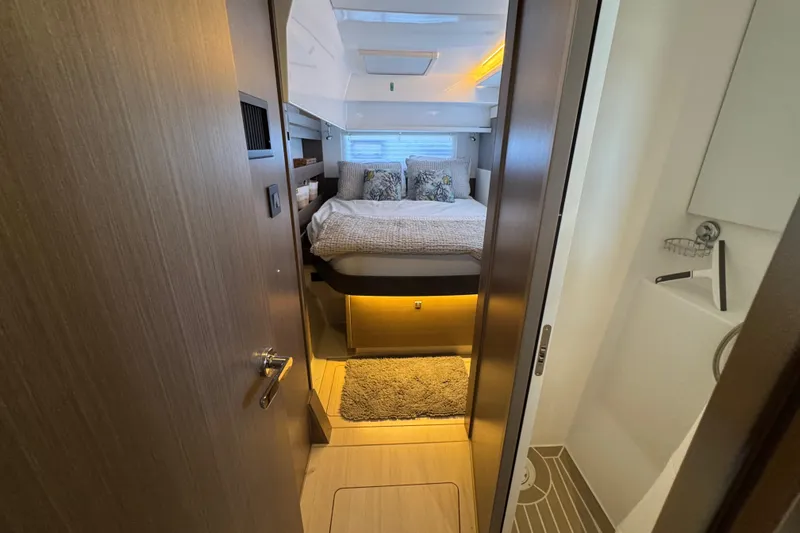 Jolly Time Yacht Photos Pics Interior of 2021 Leopard 42 yacht bedroom with cozy bed and modern design.