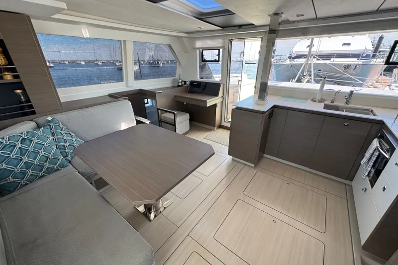 Jolly Time Yacht Photos Pics Modern interior of 2021 Leopard 42 yacht with spacious seating and kitchen area.