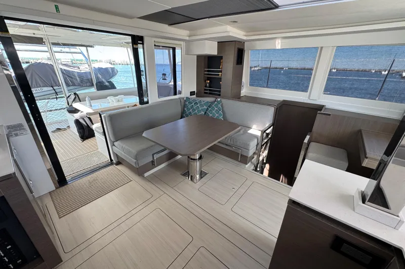 Jolly Time Yacht Photos Pics Modern interior of 2021 Leopard 42 catamaran with spacious seating and ocean view.