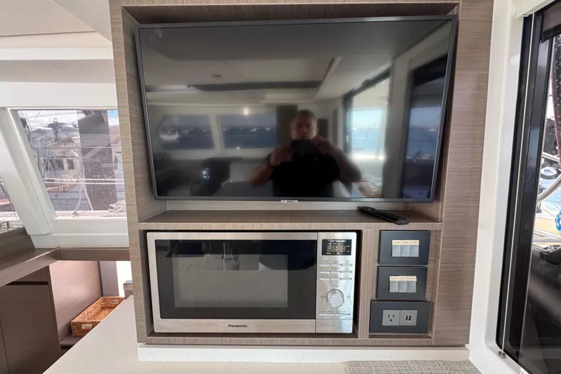 Jolly Time Yacht Photos Pics Modern kitchen setup in 2021 Leopard 42 yacht with TV and microwave.