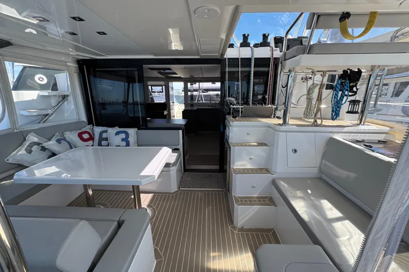 Jolly Time Yacht Photos Pics Luxurious interior of 2021 Leopard 42 yacht with modern seating and dining area.