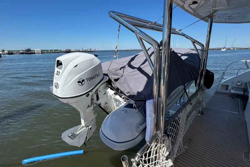 Jolly Time Yacht Photos Pics Leopard 42 catamaran with Tohatsu outboard motor and covered dinghy, 2021 model.