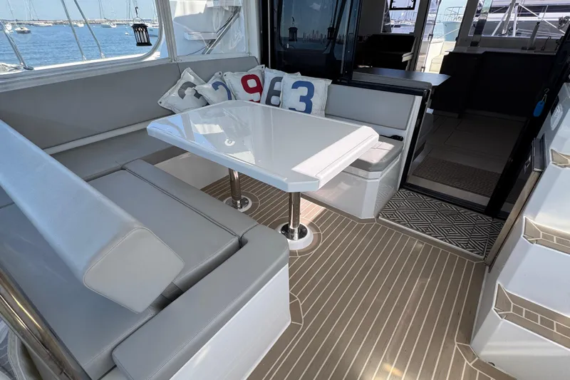 Jolly Time Yacht Photos Pics Luxurious interior of 2021 Leopard 42 yacht with modern seating and table.