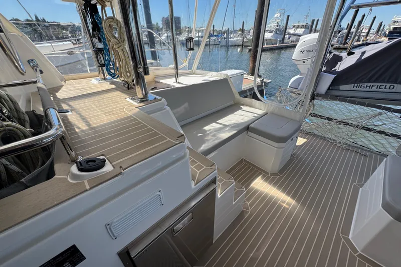 Jolly Time Yacht Photos Pics Modern Leopard 42 yacht deck with seating, ropes, and marina view, 2021 model.