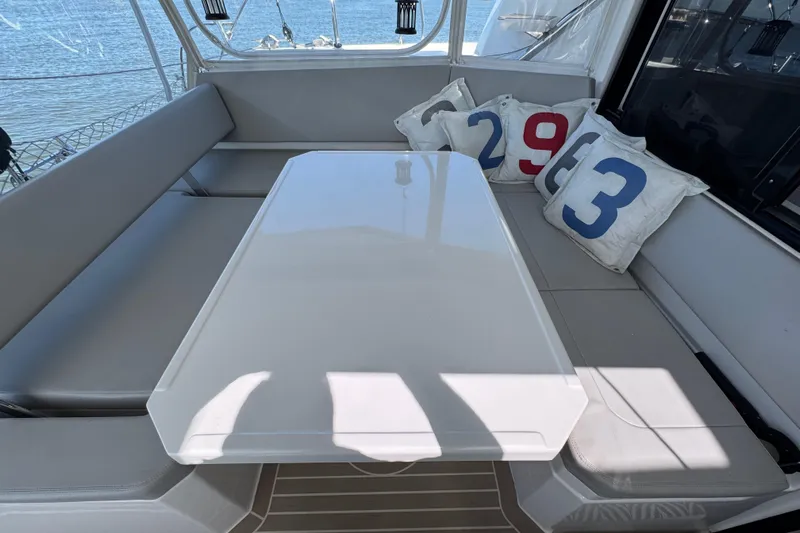 Jolly Time Yacht Photos Pics Luxurious seating area on a 2021 Leopard 42 yacht with numbered cushions.