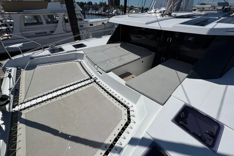 Jolly Time Yacht Photos Pics 2021 Leopard 42 catamaran with spacious deck and lounging area in marina.