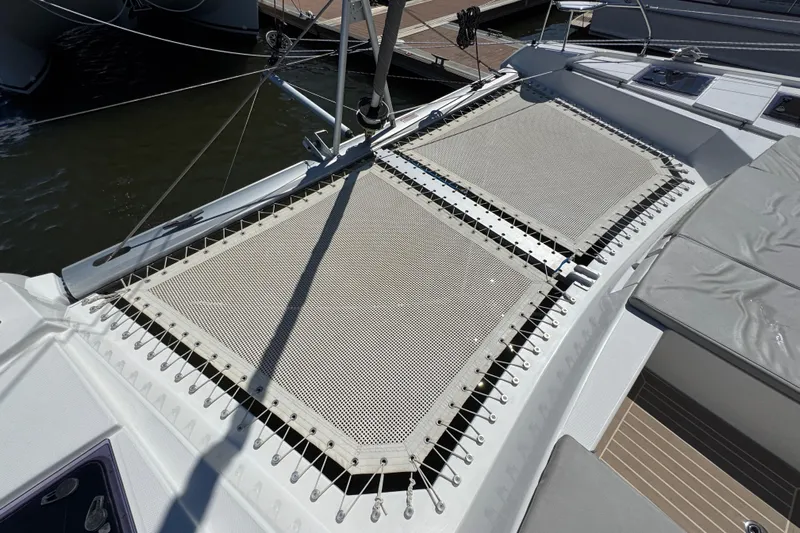 Jolly Time Yacht Photos Pics 2021 Leopard 42 catamaran with netted deck area in marina.