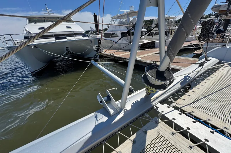 Jolly Time Yacht Photos Pics Docked Leopard 42 catamaran, 2021 model, with visible rigging and marina background.