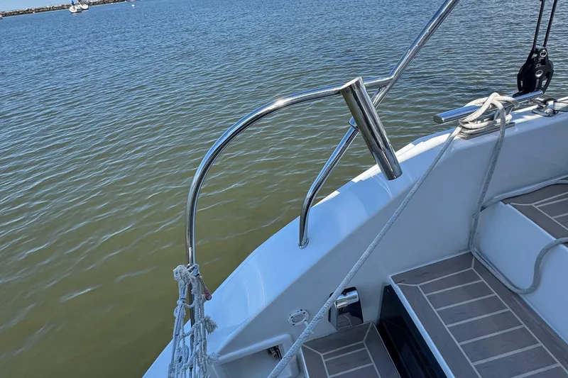 Jolly Time Yacht Photos Pics Sailing yacht Leopard 42, 2021 model, deck view with railing and ropes by the water.