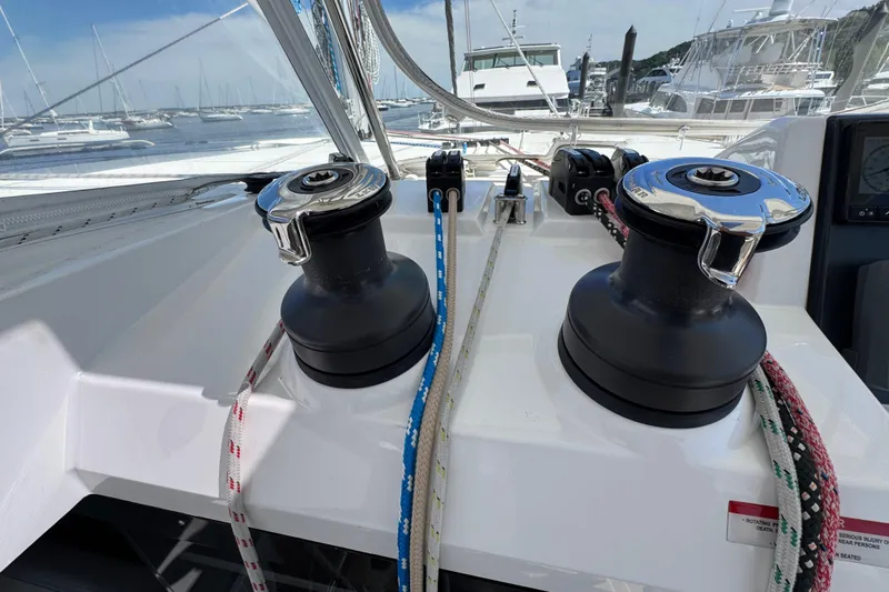 Jolly Time Yacht Photos Pics Sailing yacht Leopard 42, 2021 model, featuring winches and ropes at the helm station.